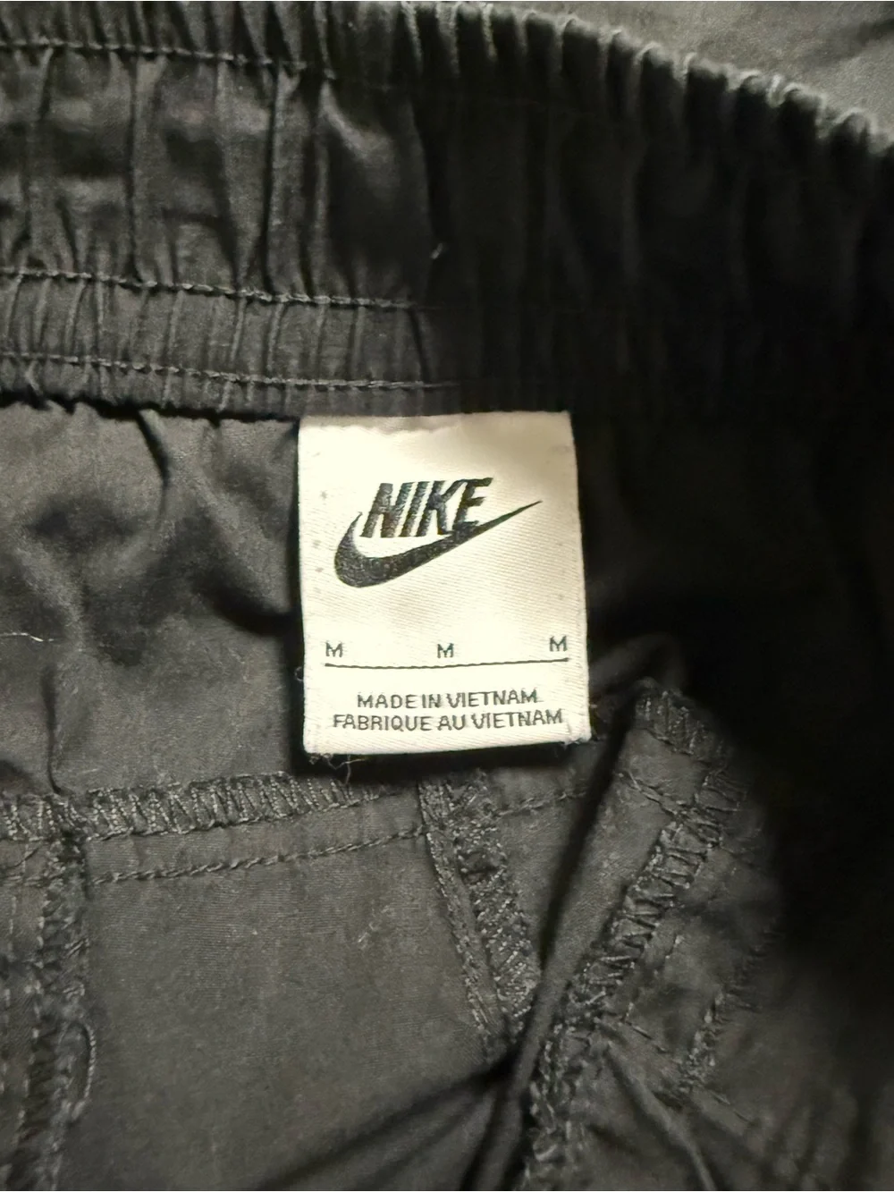 Nike Men's Black Jogger-Style Sweatpants with White Swoosh